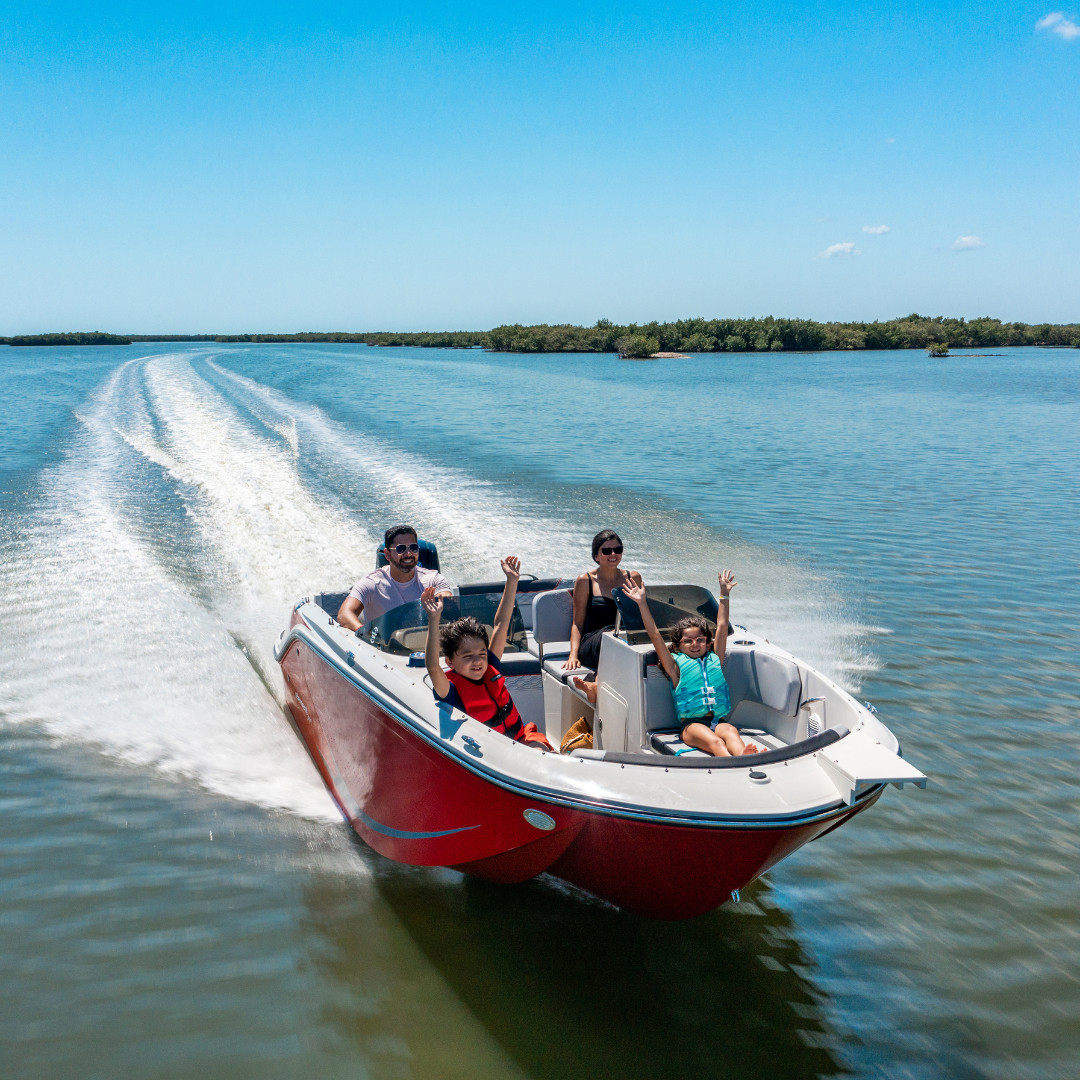 Family enjoying their new boat from Fish and Ski Marine